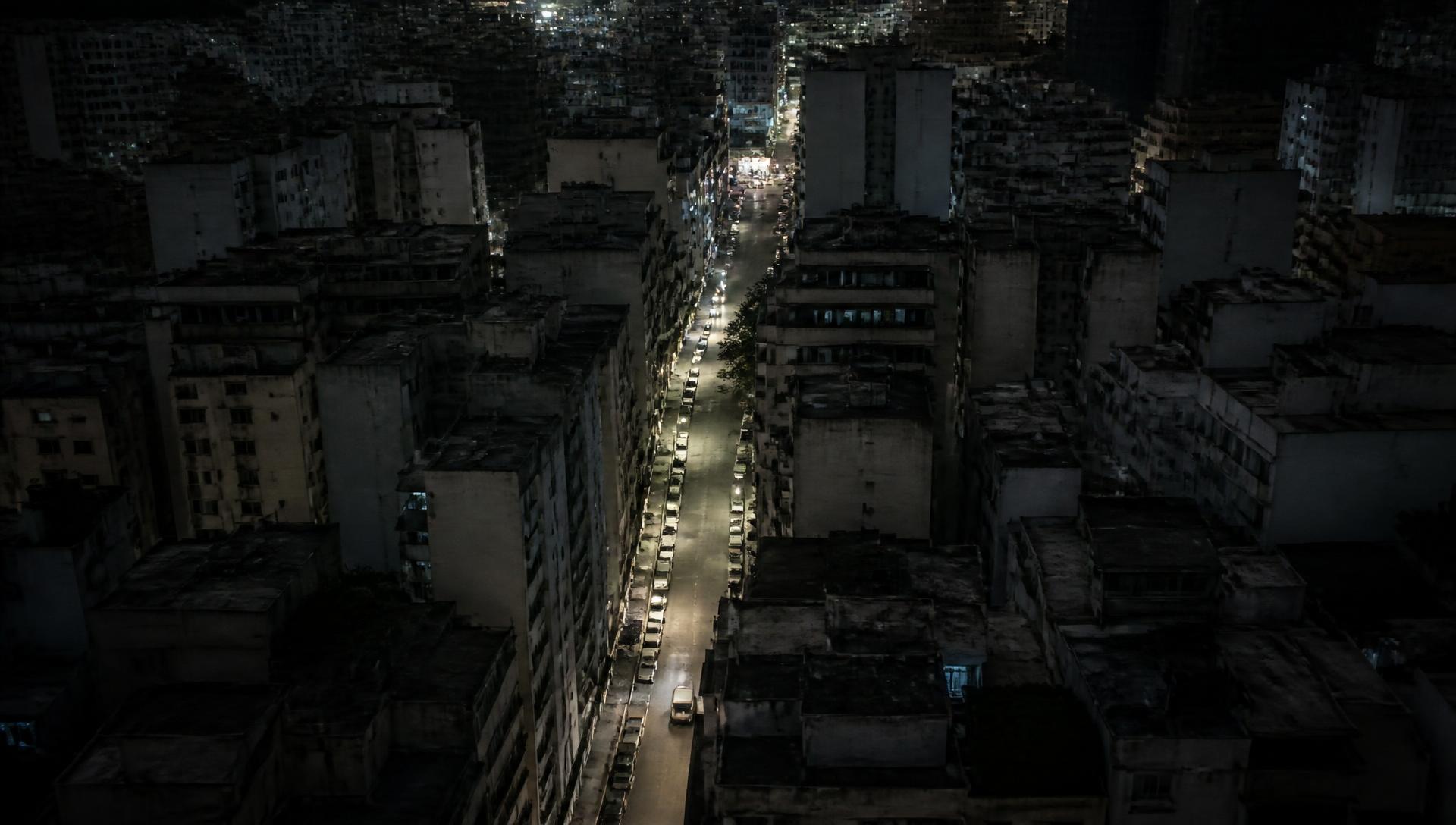 Aerial plate of a dense urban corridor at night